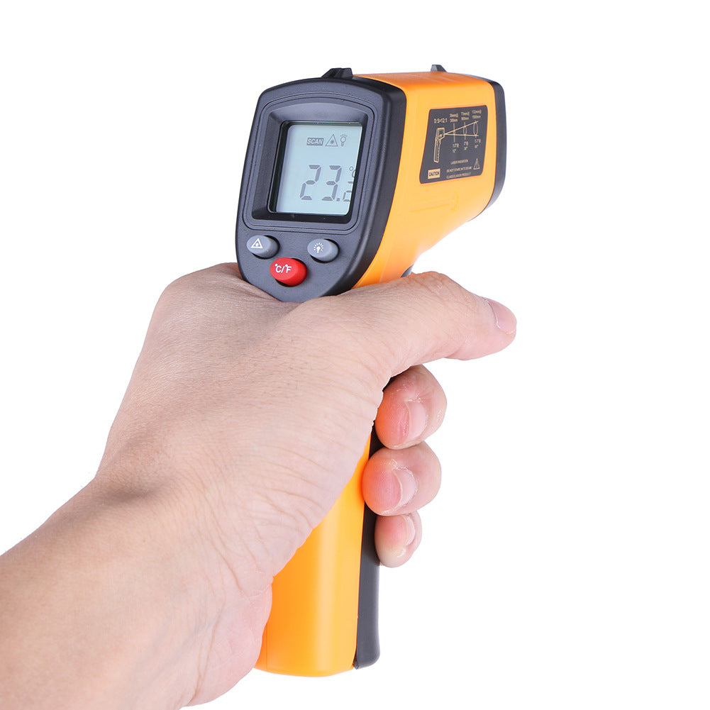 Infrared thermometer gun held in hand