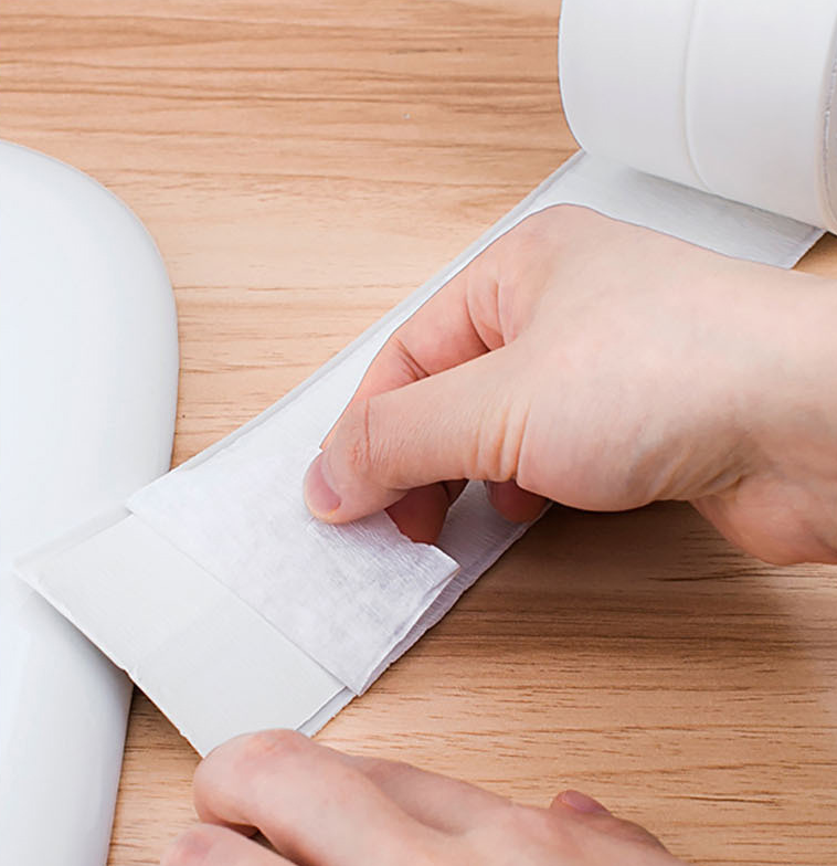 Peeling the adhesive backing