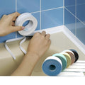 Fitting the sealant strip along a bath