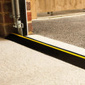 Threshold seal fitted under a garage door