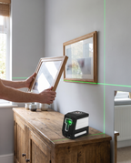 Laser level lines used to hang a picture frame